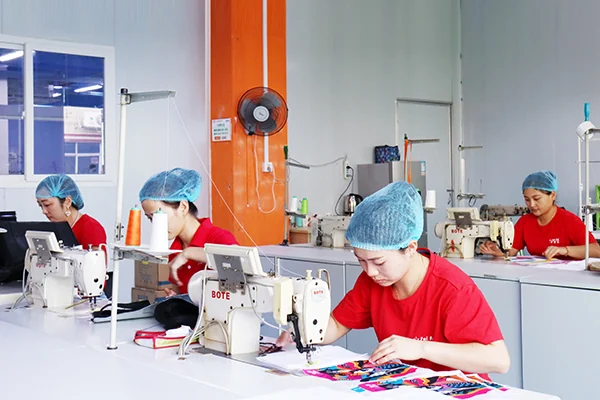 Chinese bag factory sewing workshop with workers making custom bags